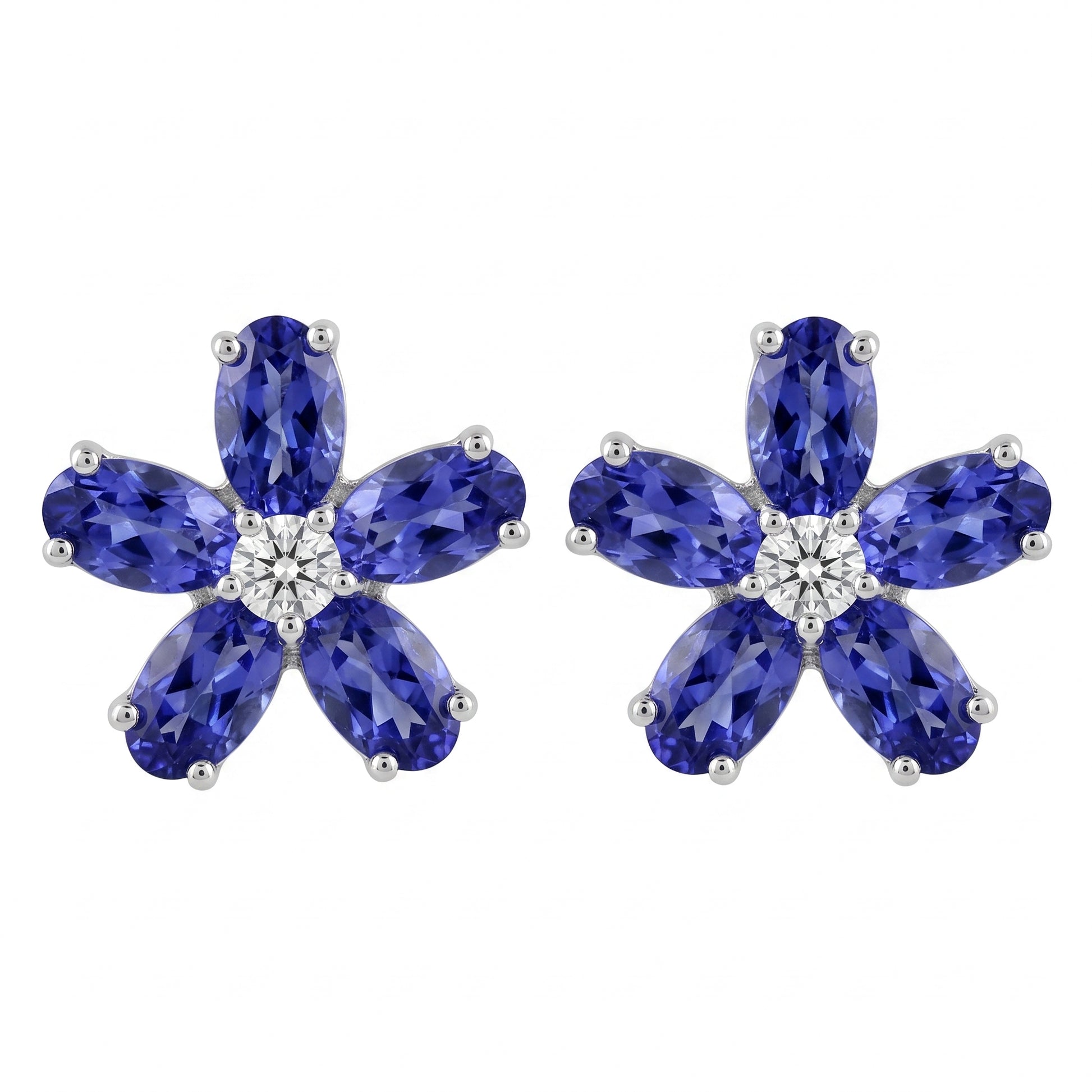 18k white gold ten oval 3x5mm tanzanite and two round diamond flower post earrings, white background